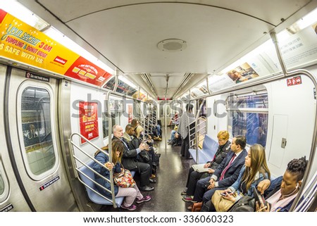 NEW YORK, USA - OCT 21 2015: People travel in the Metro in  New York. With 1.75 billion annual ridership, NYC Subway is the 7th busiest metro system in the world.