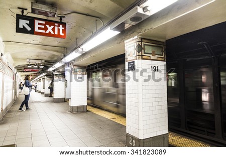 NEW YORK, USA - OCT 22, 2015: People wait at subway station 191st street in New York. With 1.75 billion annual ridership, NYC Subway is the 7th busiest metro system in the world.