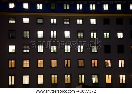 windows of a business house with light by night giving a structured impression, vienna