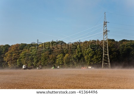 a new electricity pylon will be errected in the countryside in foggy weather but blue sky