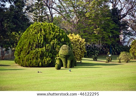 bushes cut to animal figures in the park of Bang Pa-In Palace near Bangkok, Thailand (Summer Palace of the Thai king) near Ajuttaya