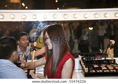BANGKOK, THAILAND - May 11: cosmetic company AMWAY sponsors a makeup course with its products in the central world center and assists woman in using products , May 11, 2009 in Bangkok, Thailand