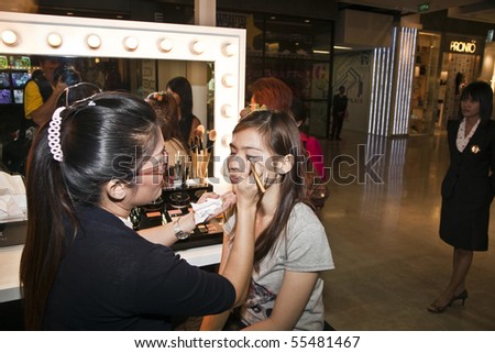BANGKOK, THAILAND - May 11: cosmetic company AMWAY sponsored a makeup course with its products in the central world center and assists woman in using products , May 11, 2009 in Bangkok, Thailand