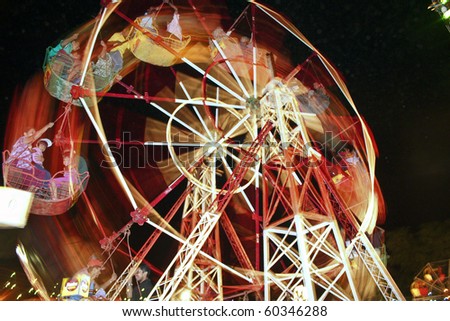 CANDY, SRI LANKA - AUG 13: big wheel powered by man as amusement part of  the festival Pera Hera in Candy to celebrate the tooth of Buddha August 13,2005, Candy, Sri Lanka