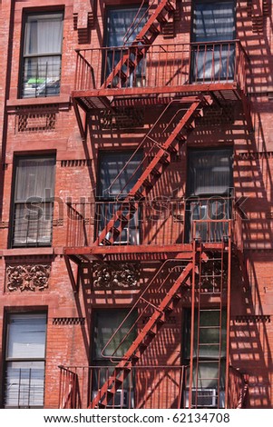 fire ladder at old beautiful houses downtown in New York