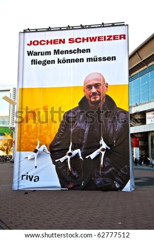FRANKFURT, GERMANY - OCTOBER 10: public day for Frankfurt Book fair, Artists have a show on ropes  to promote a Book of Jochen schweitzer  on October 10, 2010 in Frankfurt, Germany.