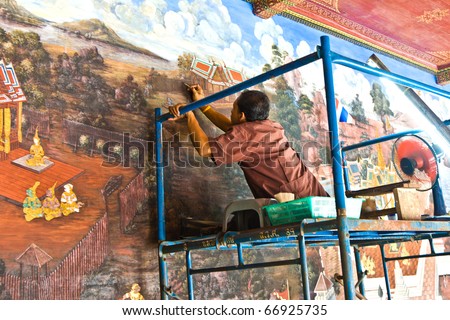 BANGKOK, THAILAND - DECEMBER 31: worker restores the famous paintings in the Grand Palace precisely with old technics  of handicraft painting on December 31, 2007 in Bangkok, Thailand.