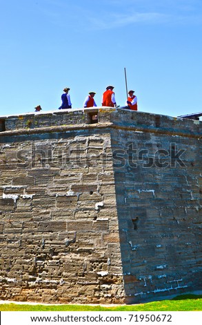 ST. AUGUSTINE, USA - JUL 23: historical weapons demonstration in historic Castillo de San marco in original costumes for tourists on  July 23, 2010 in St. Augustine, USA.