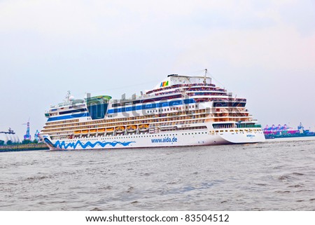 HAMBURG, GERMANY - 25 AUGUST: the famous cruise liner AIDA leaves the harbor at August 25, 2011 in Hamburg, Germany. AIDA Cruise Lines carries more passengers than any other line in the country.
