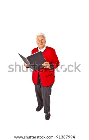 smiling attractive elderly woman reading in a book and making a speech
