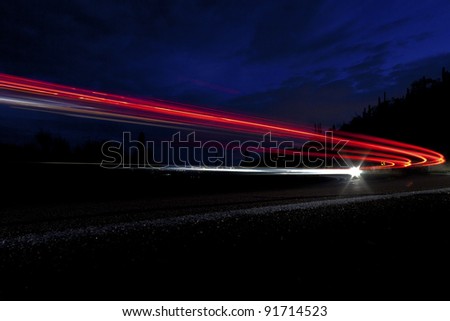 car light on interstate in mountain desert  landscape in Arizona