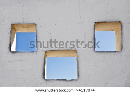 facade of house  with open windows in sunlight