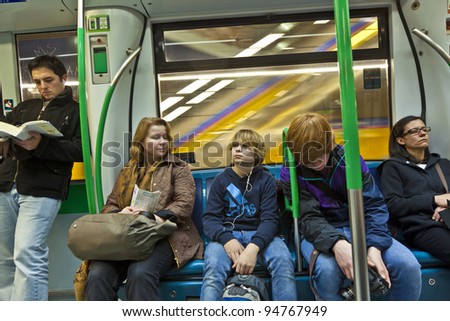 MADRID, SPAIN-DEC 20: people travel by metro to center on December 20,2010 in Madrid, Spain. Madrid runs the third largest underground train network in europe, and the sixth largest  in the world.