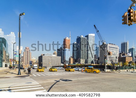 NEW YORK, USA - OCT 21, 2015: street view with people in the neighborhood Hells Kitchen  in New York City, USA. Hell\'s Kitchen was once a bastion of poor and working-class Irish Americans.