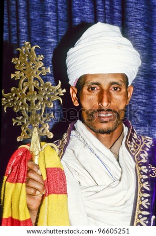 AXUM, ETHIOPIA - MAY 07: coptic priest in Ethiopia in his church on May 07,1998 in Axum, Ethiopia.The Coptic Church is based on the teachings of Saint Mark from the year 200 A.D. during reign of Nero.