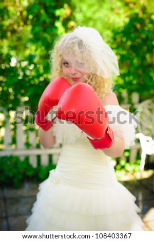 Bride with boxing gloves. Wedding fun box