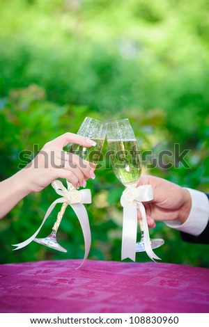bride and groom. wedding. summer street cafe. champagne glasses.