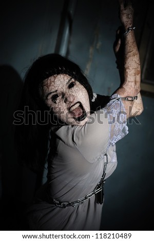 Halloween. Vampire. Scum. Zombie woman with Cracked and Infected Skin and black eyes