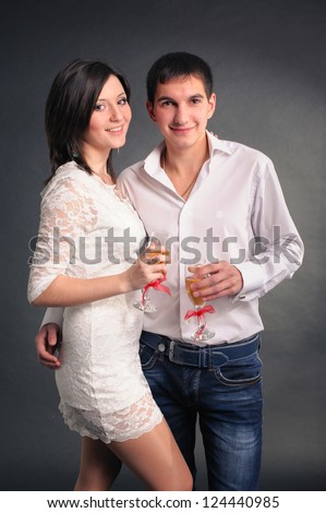 Happy young couple in love. drinking champagne