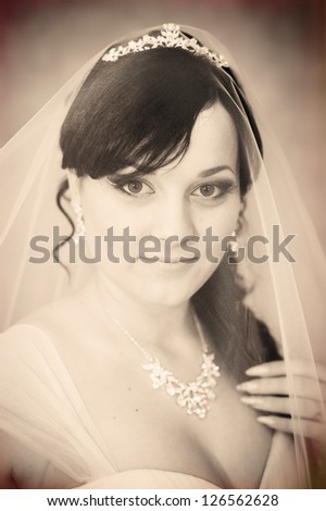 portrait of beautiful smiley bride with a veil,. Vintage photo. wedding dress.