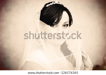 portrait of beautiful smiley bride. Vintage photo. wedding dress.
