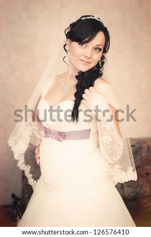 portrait of beautiful smiley bride. Vintage photo. wedding dress.