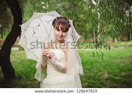 Happy young bride on her wedding day. Wedding couple - new family! wedding dress. Bridal wedding bouquet of flowers