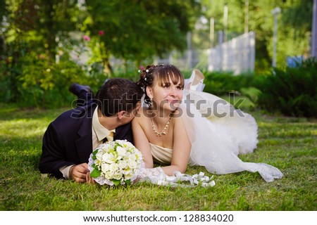 Happy young bride and groom on their wedding day. Wedding couple - new family! wedding dress. Bridal wedding bouquet of flowers