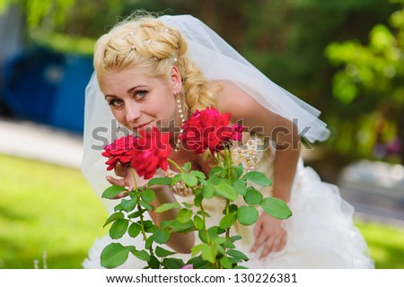 Happy young bride  outside on her wedding day - Copyspace. Wedding couple - new family! wedding dress. Bridal wedding bouquet of flowers
