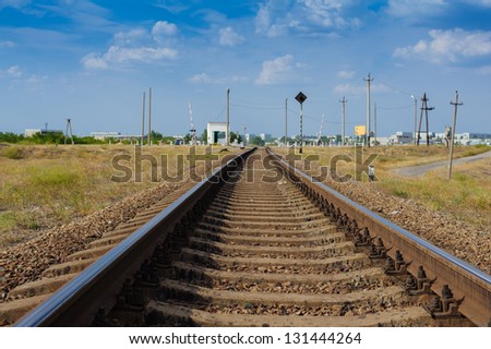 Rail tracks disappearing in the distance, low angle, near focus. Railway details.