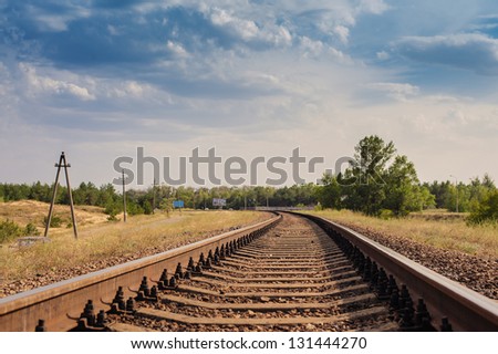 Rail tracks disappearing in the distance, low angle, near focus. Railway details.