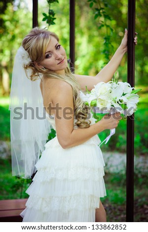 Happy young bride outside on wedding day - Copyspace. Wedding couple - new family! wedding dress. Bridal wedding bouquet of flowers