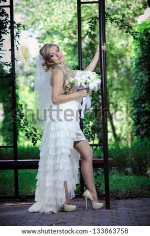 Happy young bride and outside on wedding day - Copyspace. Wedding couple - new family! wedding dress. Bridal wedding bouquet of flowers