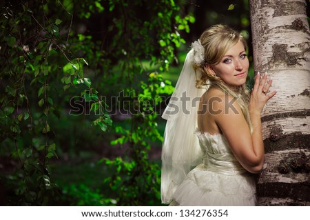 Happy young bride outside on wedding day. wedding dress. Bridal wedding bouquet of flowers