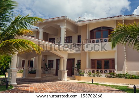 Luxurious Villa In Dominican Republic. Beautiful Villa With An Own Swimming Pool. Villa On Luxury Caribbean Resort With Beautiful Garden. Classical Spanish Villa Among Flowers, Not Far From Ocean.