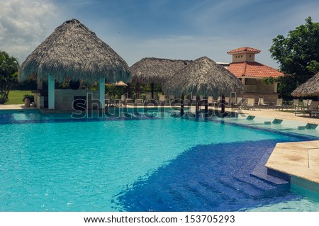 Outdoor resort pool Swimming pool of luxury hotel. Swimming pool in luxury resort near the sea. Tropical Paradise. Swimming pool in spa resort. Dominican Republic, Seychelles, Caribbean, Bahamas.