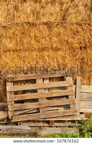 Internal side of a barn. Rural italian hayloft. Straw in the old barn with timber wall. Tuscany agriculture. Italy.