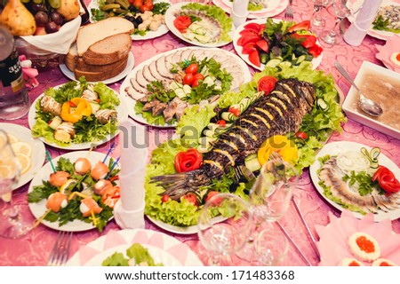 Wedding table. Table set for wedding dinner. wedding party favors on plate at reception