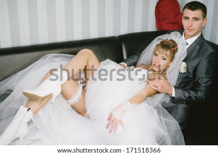 Cute married couple in cafe. romantic rest in vintage cafe interior. Charming bride and groom on their wedding celebration in a luxurious restaurant.