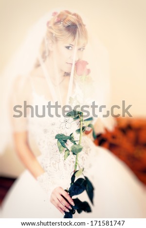 holding a red rose. bride and wedding concept - young woman with rose flower