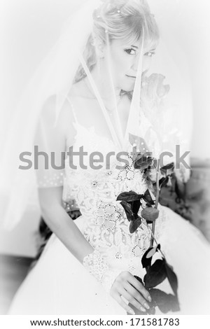 holding a red rose. bride and wedding concept - young woman with rose flower
