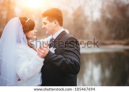 bride and groom. Happy married couple enjoying wedding day in nature. Elegant bride and groom posing together outdoors on a wedding day. wedding theme.