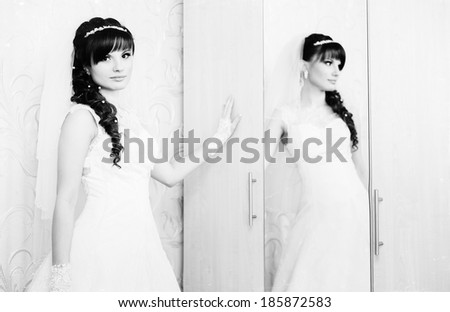 beautiful bride in white wedding dress with hairstyle and bright makeup. Happy sexy girl waiting for groom. Romantic lady in bridal dress and flowers in hair have final preparation for wedding