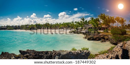 Panorama of Tropical beach, ocean and sky. beautiful beach and tropical Caribbean sea. Vocation and travel in Dominican Republic, Seychelles, Caribbean, Bahamas. Relaxing on remote Paradise beach.