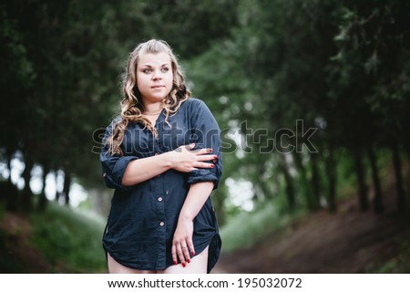 Fat girl outdoor. Portrait of young fat woman in park. attractive overweight woman walking outdoor.