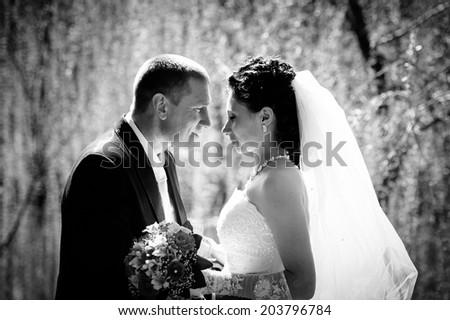 Happy bride and groom on their wedding, black and white
