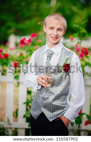Happy young groom on their wedding day. Handsome caucasian man in tuxedo