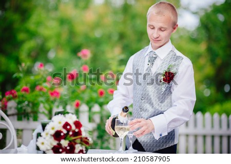 Happy young groom on their wedding day. Handsome caucasian man in tuxedo
