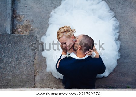 Happy young bride and groom outdoors in the park on their wedding day. Wedding couple - new family! wedding dress. Bridal wedding bouquet of flowers