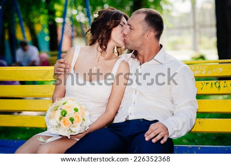 Groom and Bride in a park. wedding dress. Bridal wedding bouquet of flowers. Bride and Groom at wedding Day walking Outdoors on spring nature.  Loving wedding couple outdoor